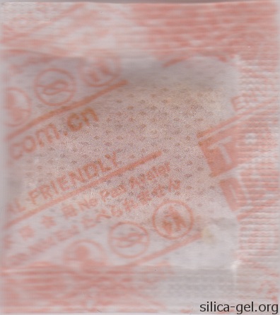 TOPCOD desiccant packet printed in orange. (rear image)